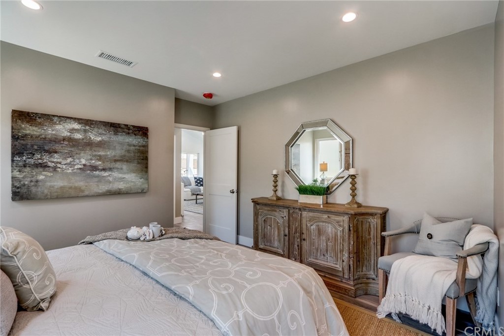 4566 166th Street Lawndale, CA 90260 - Photo 41 of 64 a bedroom with a bed a mirror and furniture