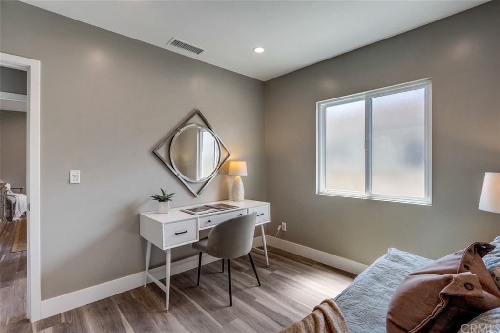 4566 166th Street Lawndale, CA 90260 - Photo 44 of 64 a bedroom with a bed a desk and chair