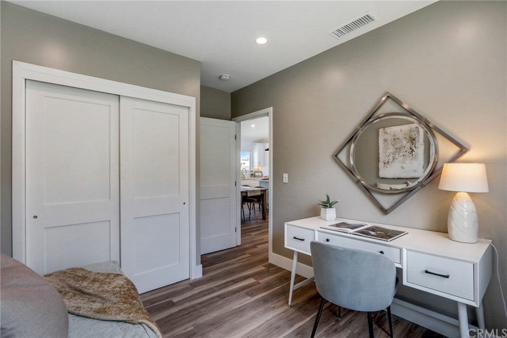 4566 166th Street Lawndale, CA 90260 - Photo 45 of 64 a living room with furniture a mirror and a table