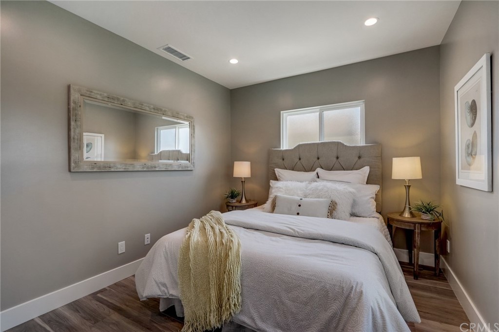 4566 166th Street Lawndale, CA 90260 - Photo 47 of 64 a bedroom with a bed and wooden floor