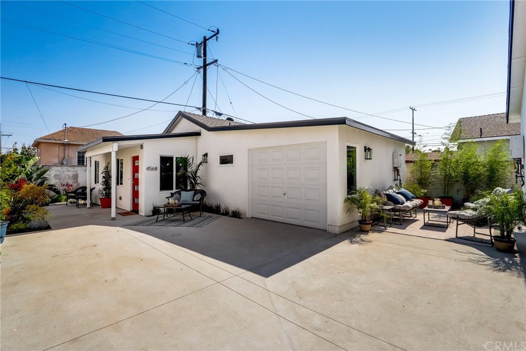4566 166th Street Lawndale, CA 90260 - Photo 52 of 64 a view of a patio with a table and chairs under an umbrella