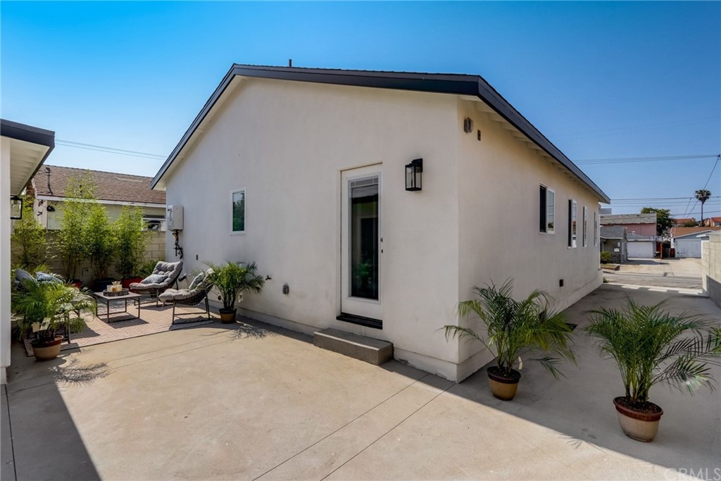 4566 166th Street Lawndale, CA 90260 - Photo 53 of 64 a backyard of a house with potted plants and couches