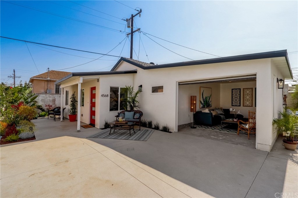 4566 166th Street Lawndale, CA 90260 - Photo 57 of 64 a view of a patio with table and chairs under an umbrella