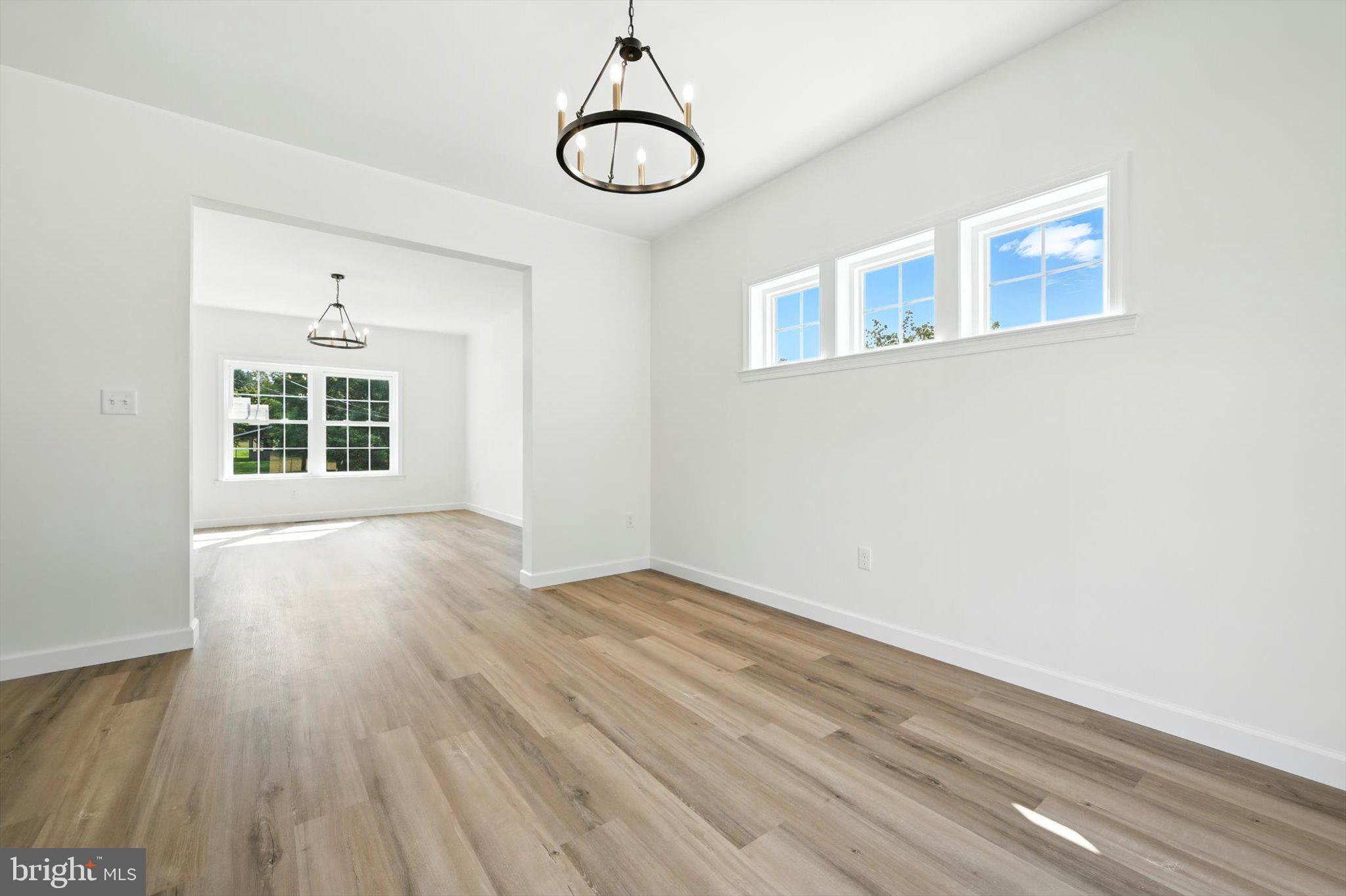 57 Ardmore Avenue Tamaqua, PA 18252 - Photo 11 of 34 a view of an empty room with wooden floor and windows