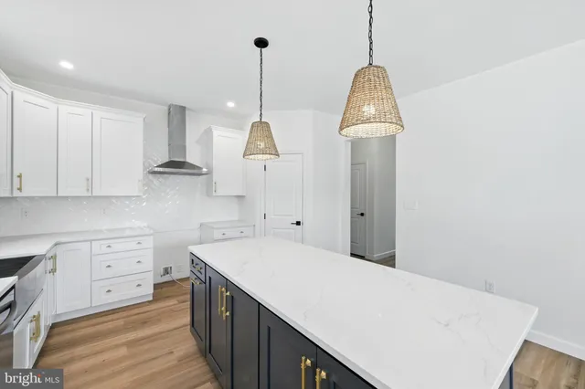 a kitchen with a sink stainless steel appliances and cabinets