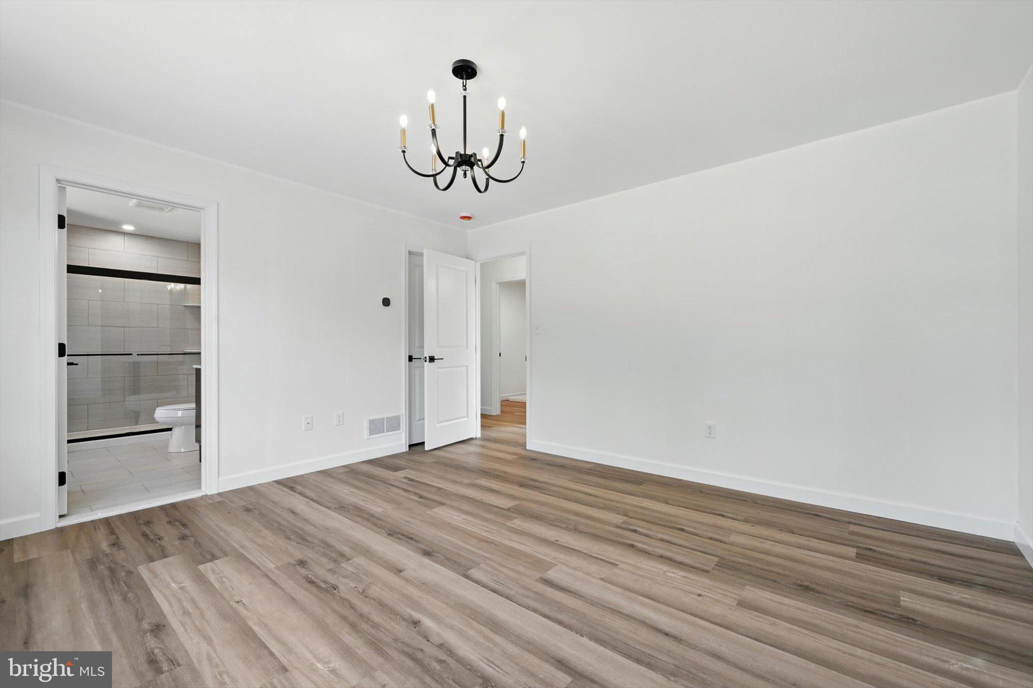 57 Ardmore Avenue Tamaqua, PA 18252 - Photo 18 of 34 a view of empty room with wooden floor and ceiling fan