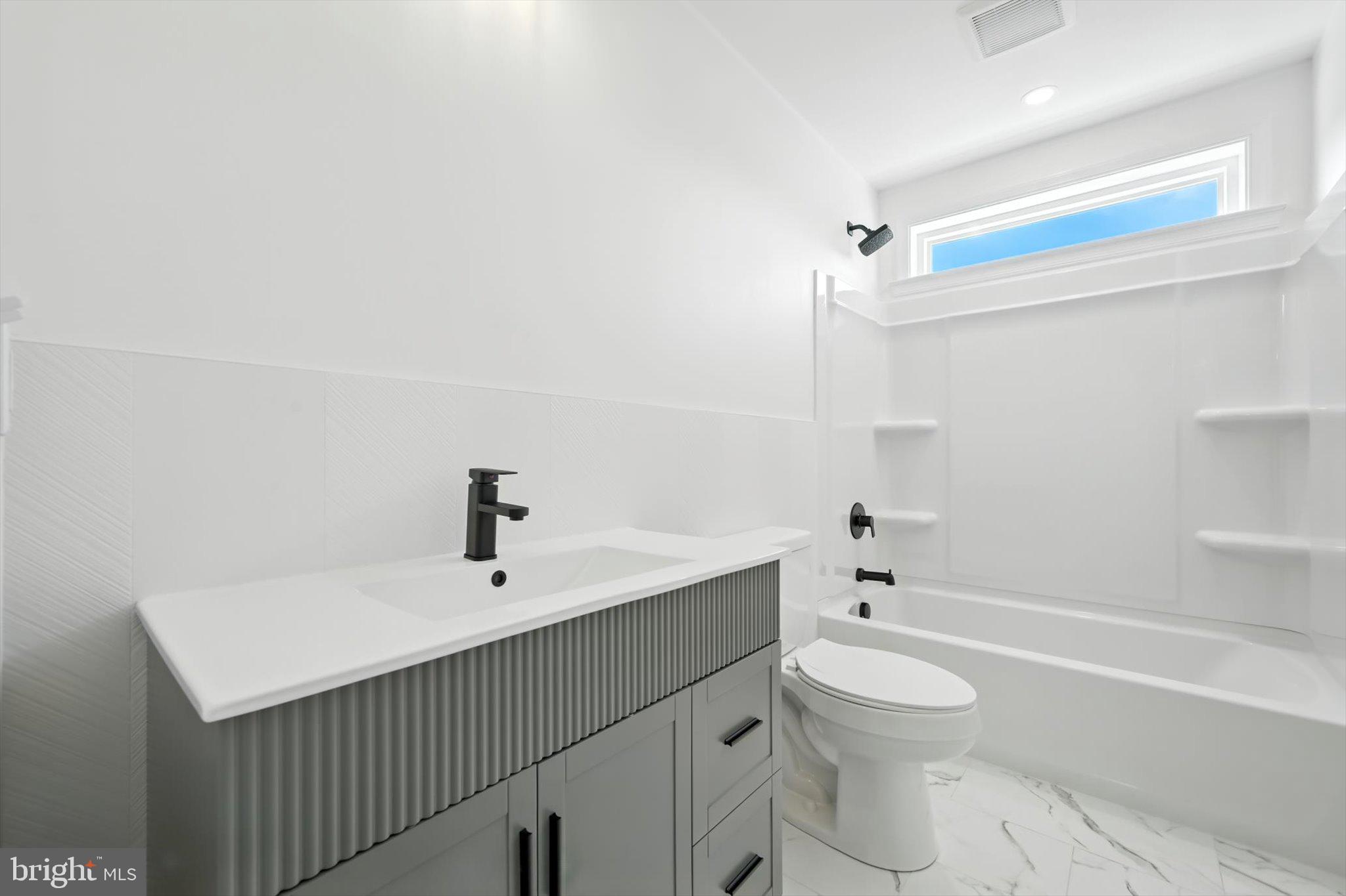 57 Ardmore Avenue Tamaqua, PA 18252 - Photo 26 of 34 a bathroom with a sink a toilet and shower