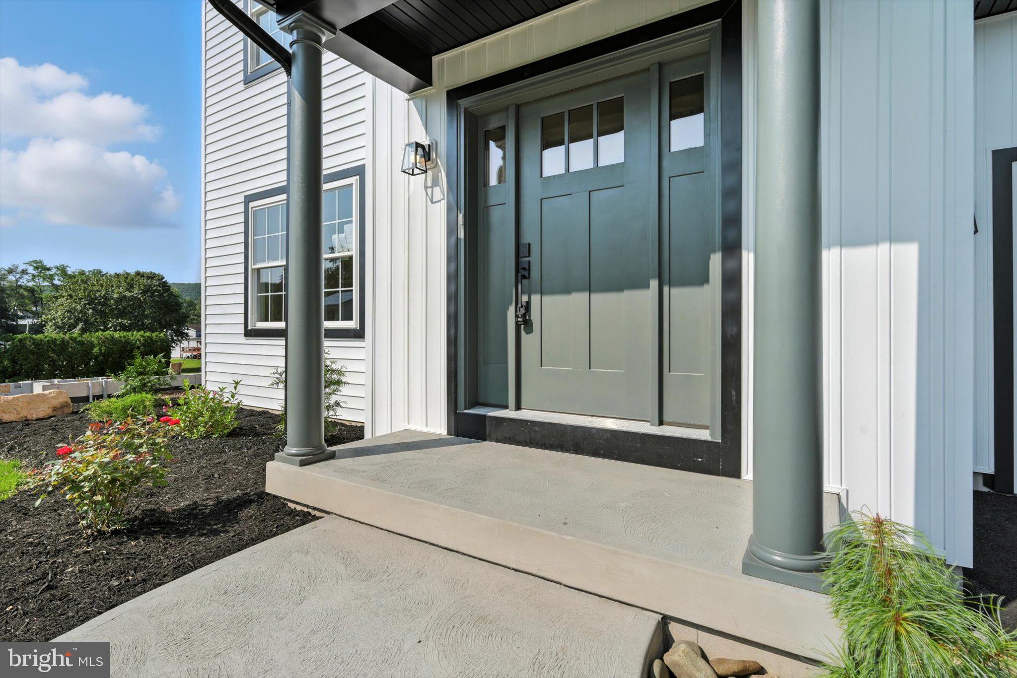 57 Ardmore Avenue Tamaqua, PA 18252 - Photo 4 of 34 a front view of a house with a garden