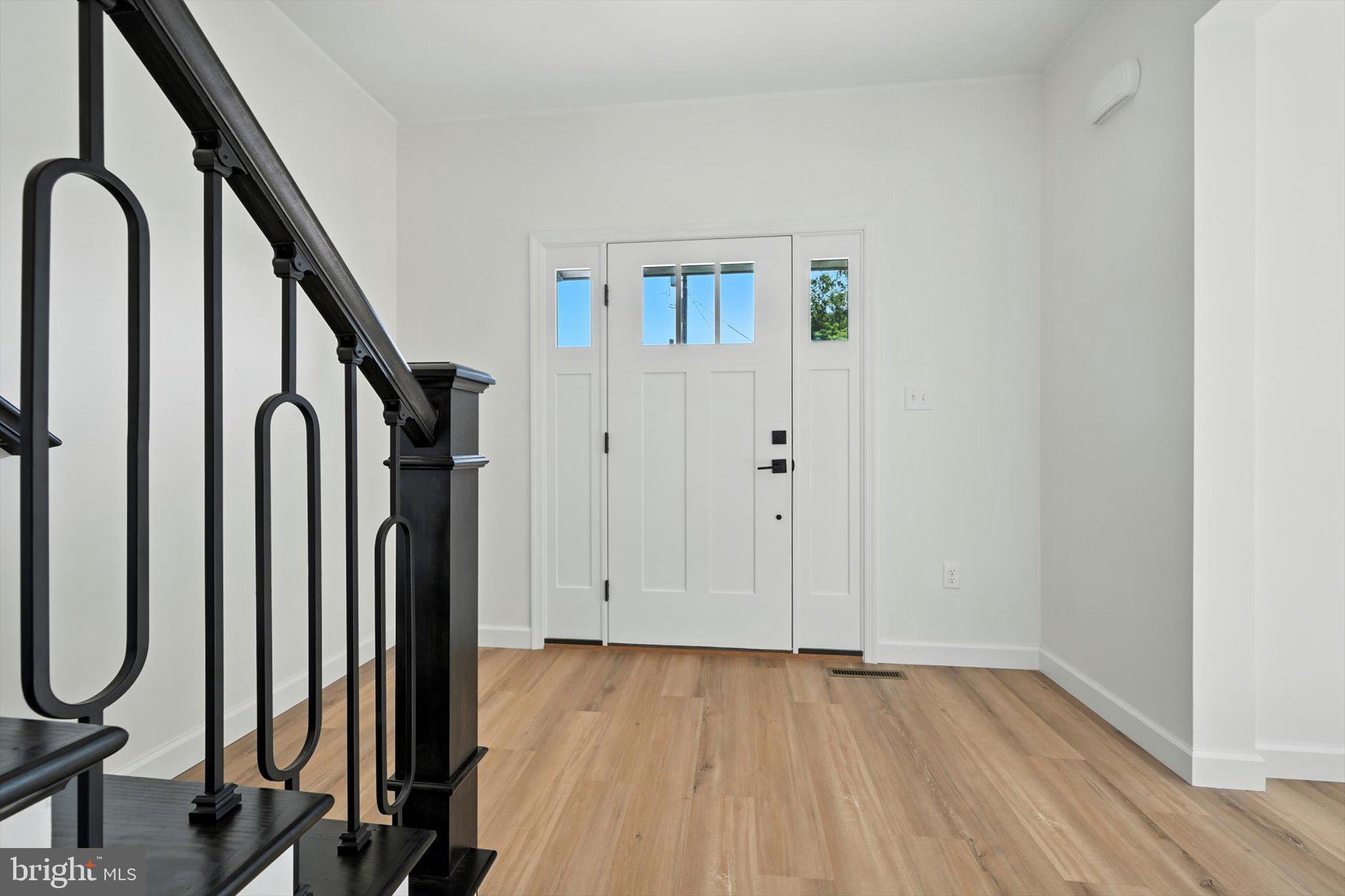 57 Ardmore Avenue Tamaqua, PA 18252 - Photo 5 of 34 a view of a room with staircase and mirror