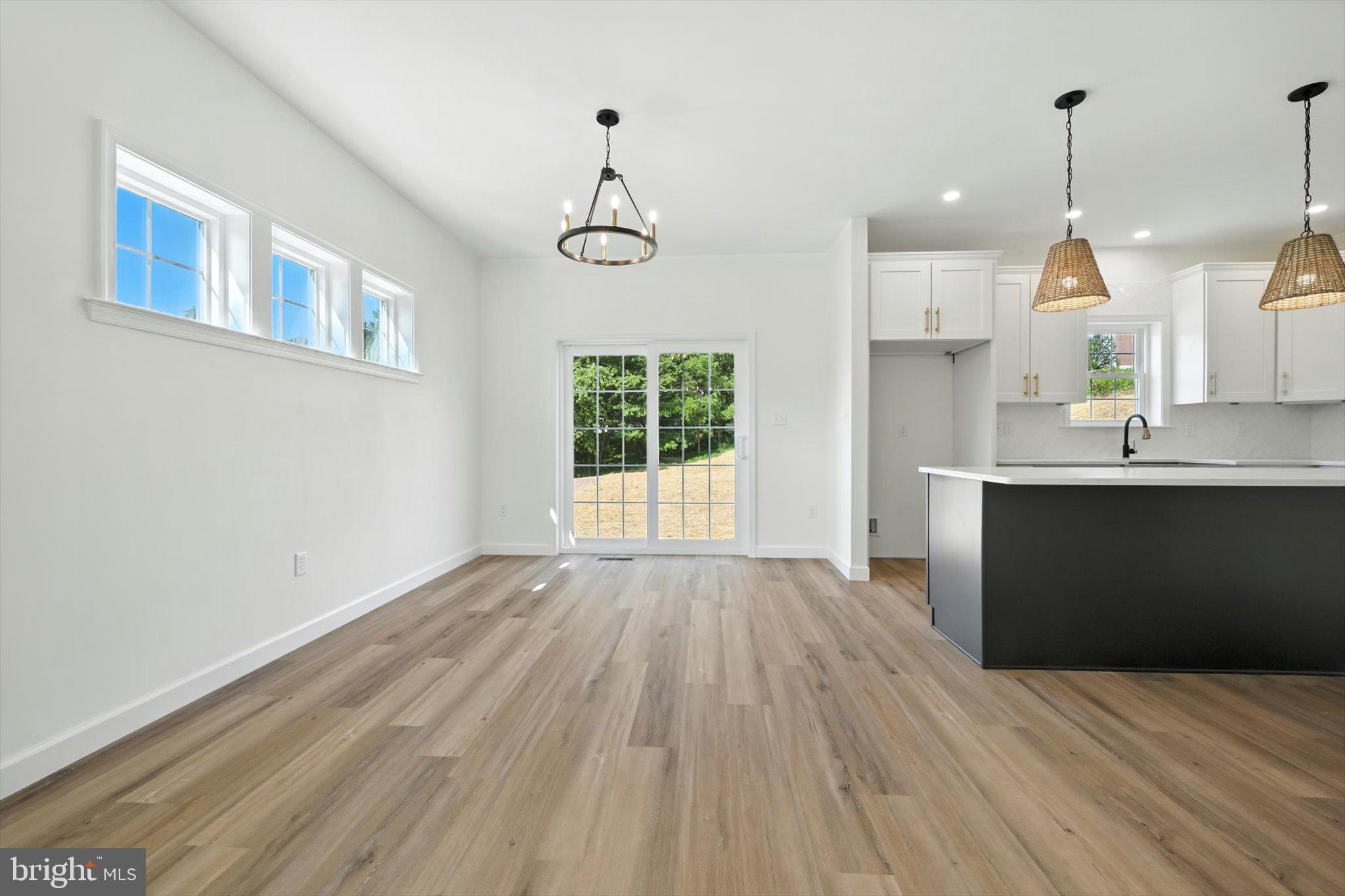 57 Ardmore Avenue Tamaqua, PA 18252 - Photo 9 of 34 a view of empty room with wooden floor and windows