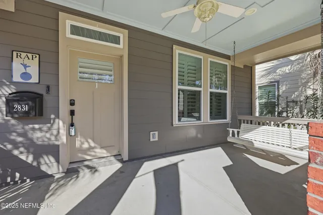 a spacious bedroom with a large bed and a large window