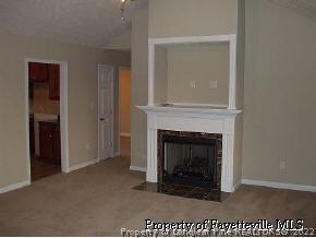 134 Wallflower Road Raeford, NC 28376 - Photo 2 of 9 a view of an empty room with a fireplace
