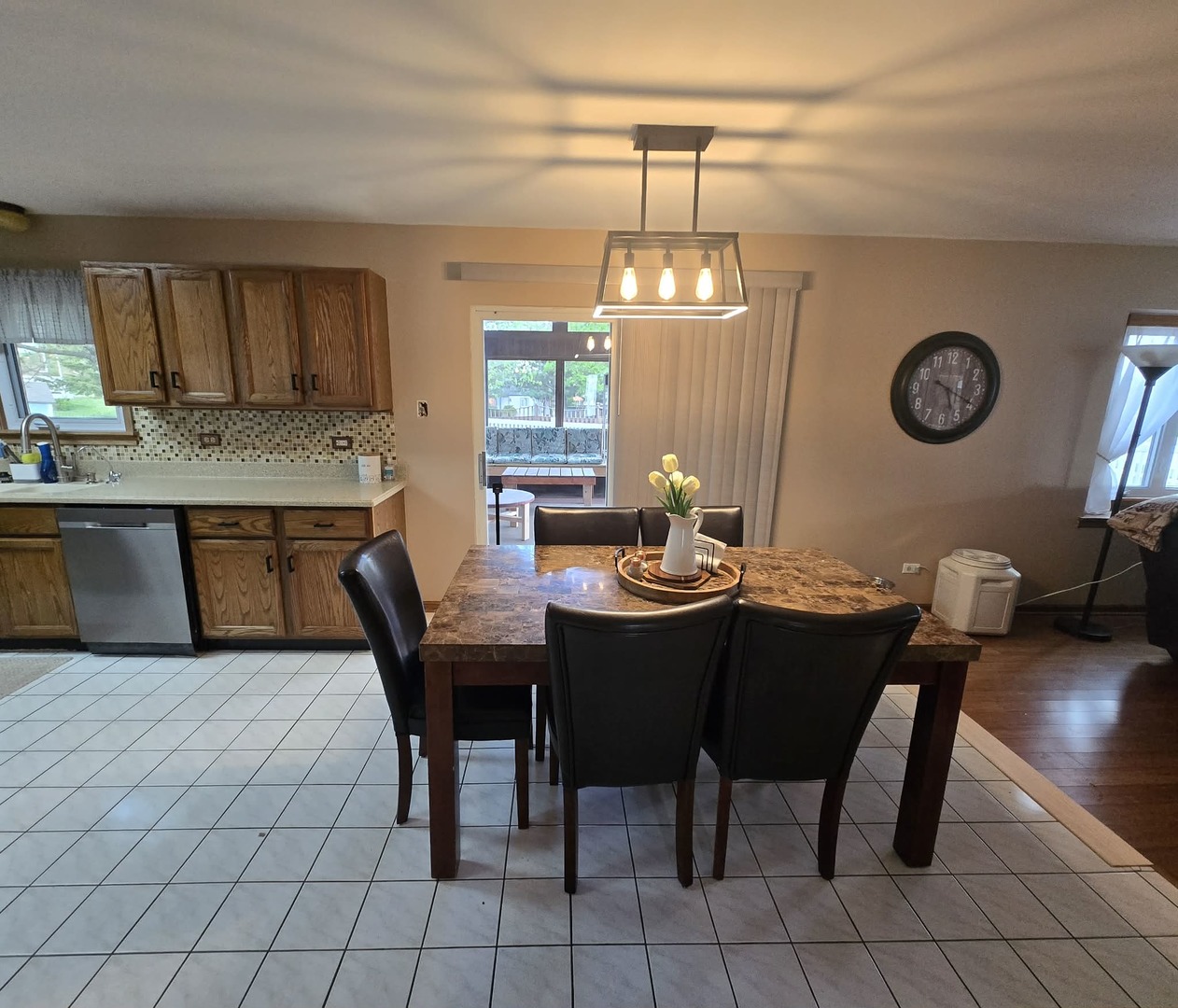 8141 Old Mill Road Frankfort, IL 60423 - Photo 11 of 39 a view of a dining room with furniture and chandelier