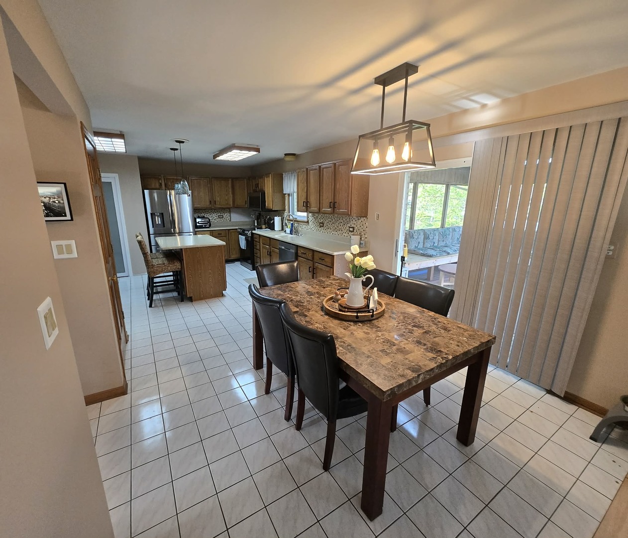 8141 Old Mill Road Frankfort, IL 60423 - Photo 14 of 39 a view of a dining room with furniture window and wooden floor
