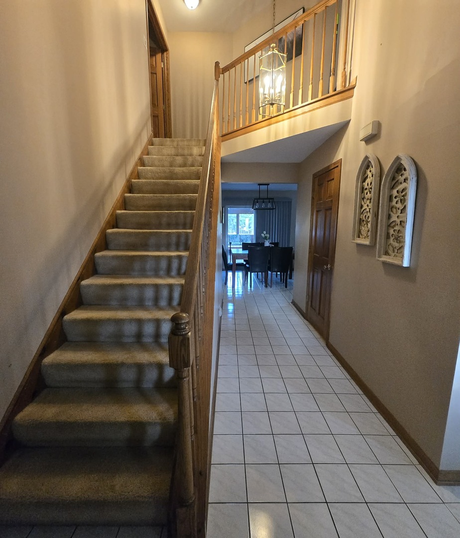 8141 Old Mill Road Frankfort, IL 60423 - Photo 3 of 39 a view of entryway and hall with wooden floor