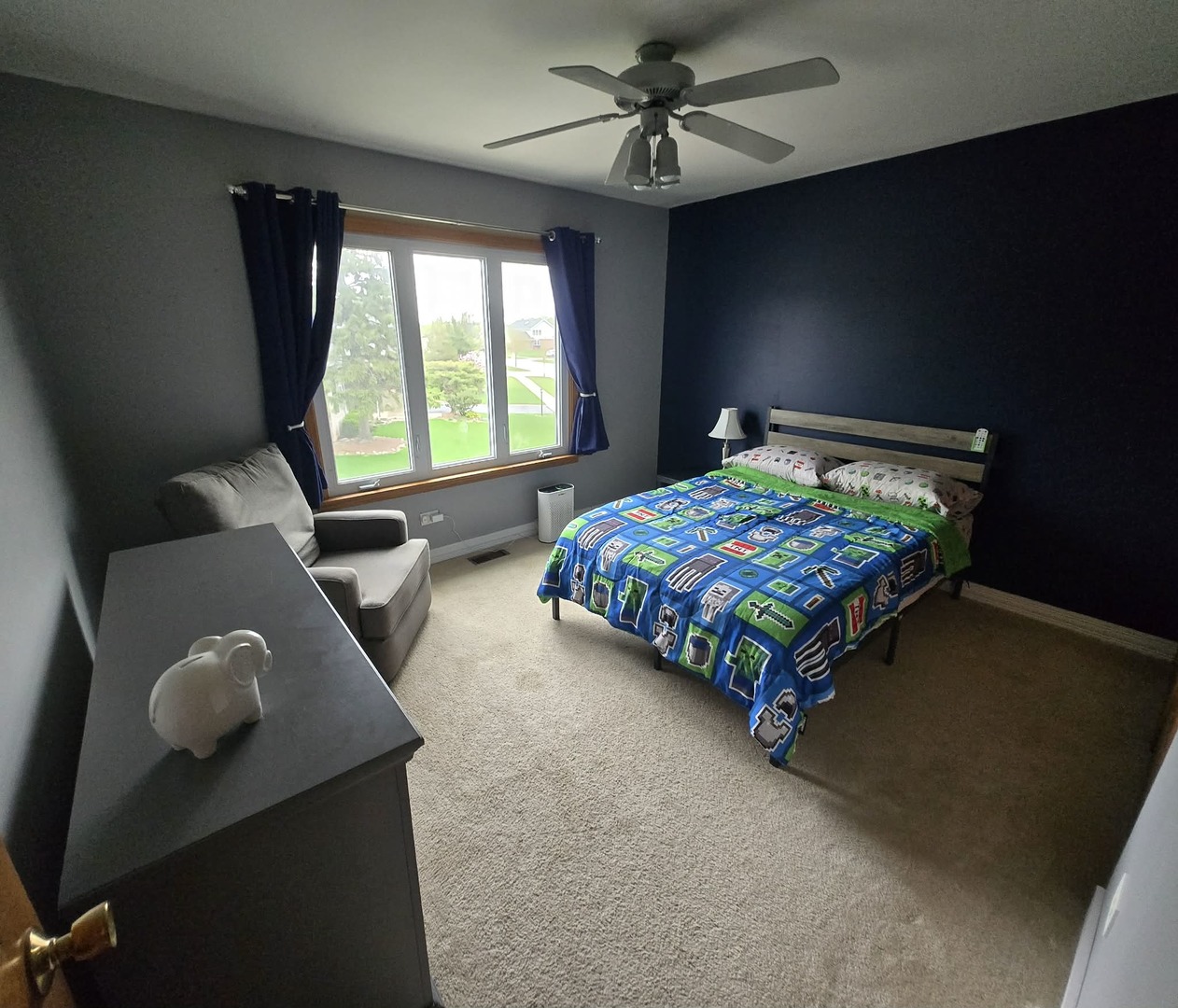 8141 Old Mill Road Frankfort, IL 60423 - Photo 32 of 39 a bed sitting in a bedroom next to a window