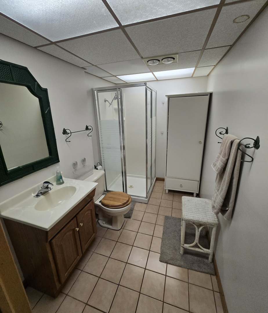 8141 Old Mill Road Frankfort, IL 60423 - Photo 35 of 39 a bathroom with a double vanity sink toilet and mirror