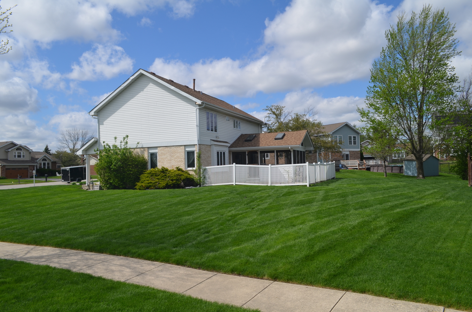 8141 Old Mill Road Frankfort, IL 60423 - Photo 37 of 39 a front view of a house with a garden