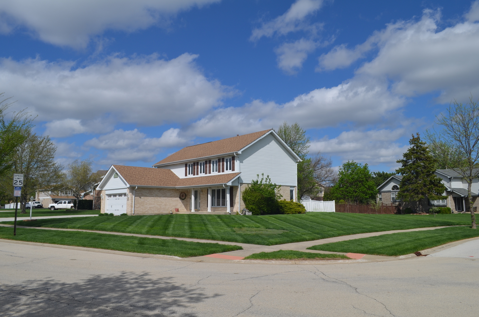 8141 Old Mill Road Frankfort, IL 60423 - Photo 39 of 39 a view of a white house next to a yard with big trees and big trees