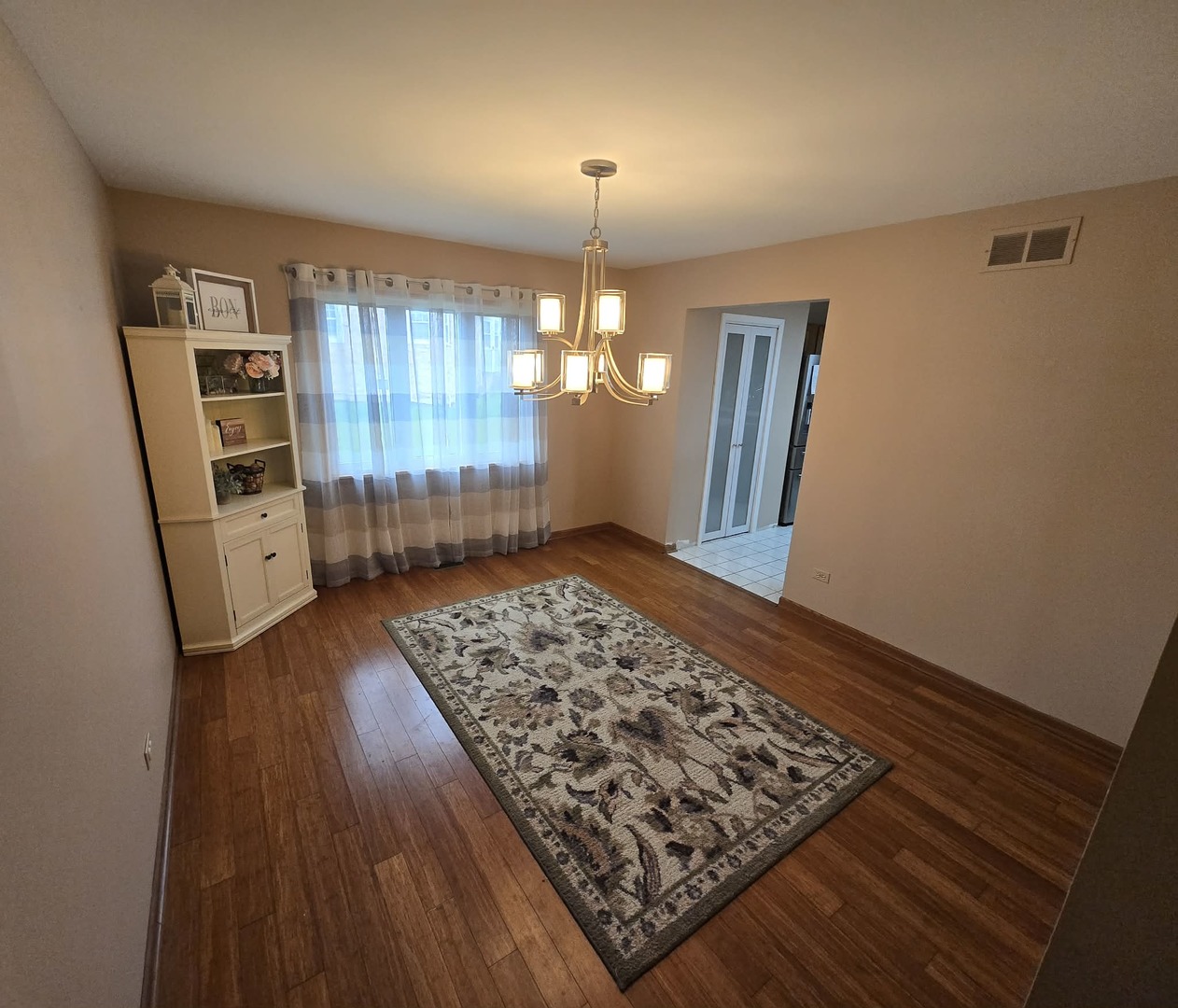 8141 Old Mill Road Frankfort, IL 60423 - Photo 7 of 39 wooden floor in an empty room with a window