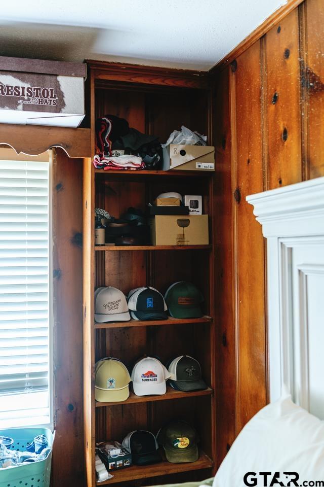 2411 Rodge Drive Tyler, TX 75701 - Photo 27 of 42 a view of walk in closet with clothes and shoes