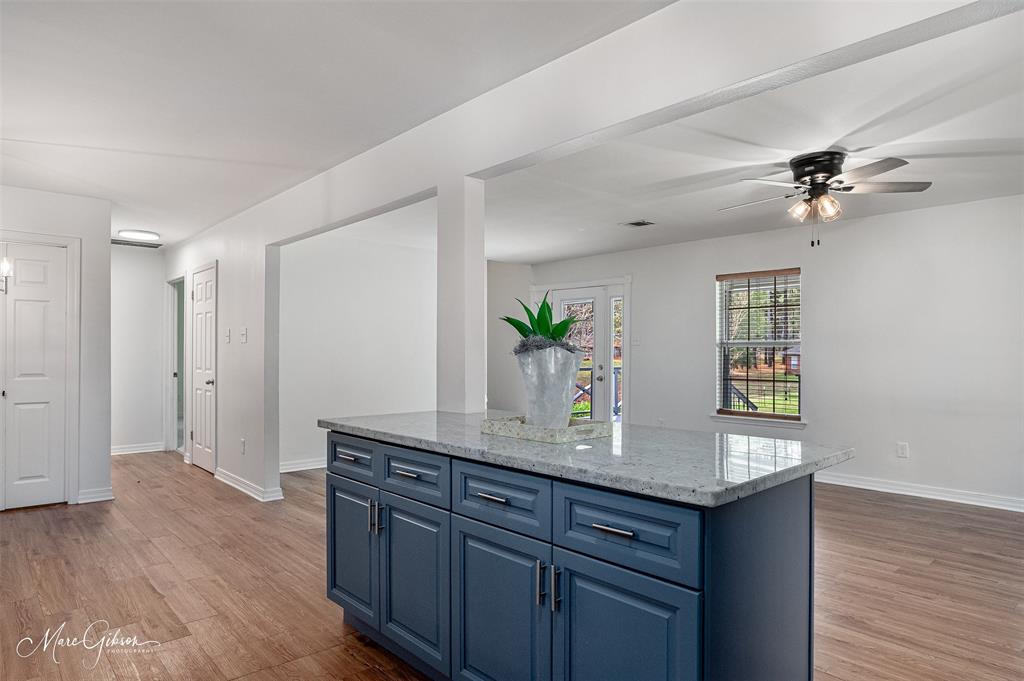 1140 Linton Road Benton, LA 71006 - Photo 12 of 39 a view of kitchen with granite countertop cabinets and wooden floor