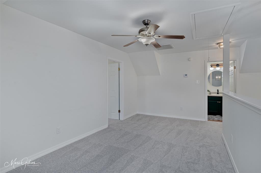 1140 Linton Road Benton, LA 71006 - Photo 21 of 39 en empty room with windows and fan