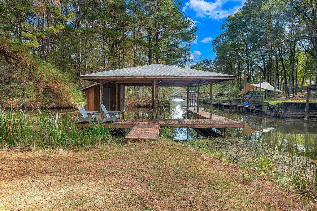 1140 Linton Road Benton, LA 71006 - Photo 32 of 39 a backyard of a house with yard table and chairs