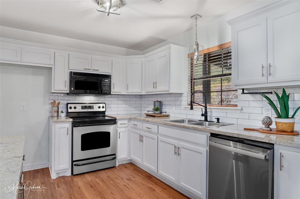 1140 Linton Road Benton, LA 71006 - Photo 9 of 39 a kitchen with a sink appliances and cabinets