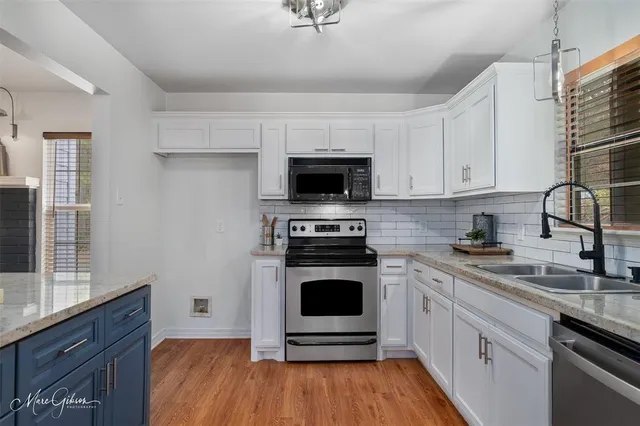 a kitchen with a stove and a sink