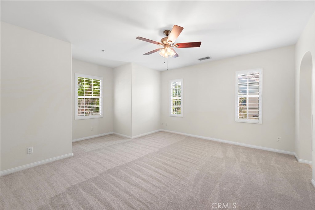 31 Notchbrook Lane Ladera Ranch, CA 92694 - Photo 16 of 24 an empty room with windows and fan