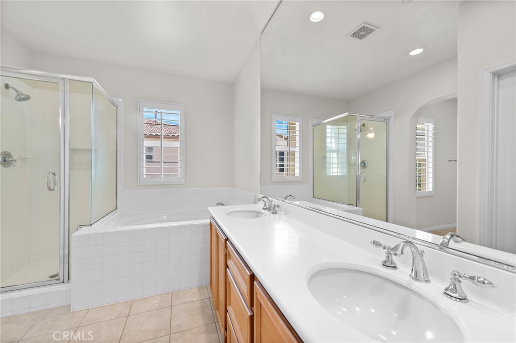 31 Notchbrook Lane Ladera Ranch, CA 92694 - Photo 18 of 24 a bathroom with a tub sink and mirror