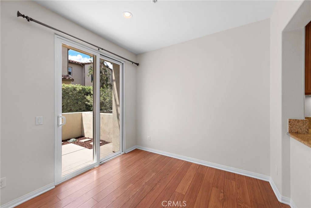 31 Notchbrook Lane Ladera Ranch, CA 92694 - Photo 7 of 24 an empty room with wooden floor and windows