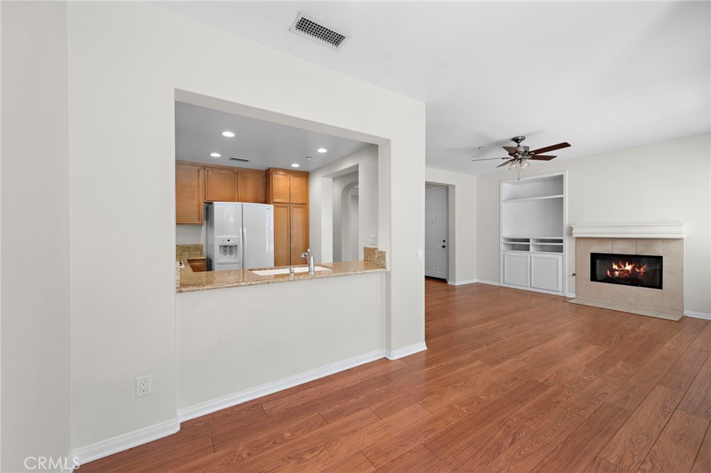 31 Notchbrook Lane Ladera Ranch, CA 92694 - Photo 8 of 24 an empty room with wooden floor and windows