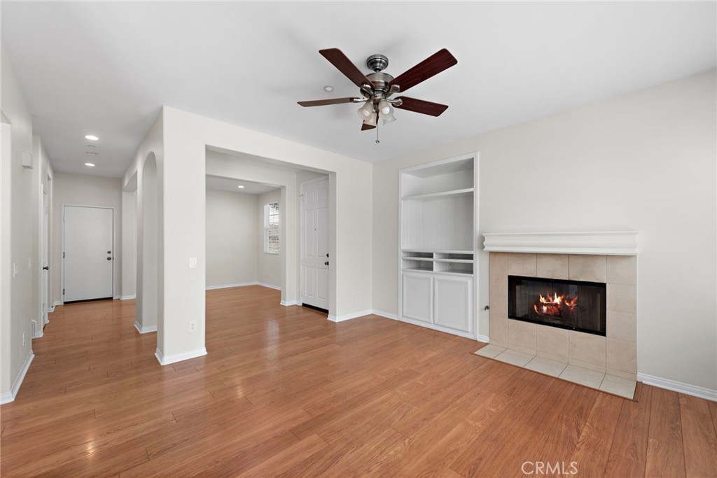 31 Notchbrook Lane Ladera Ranch, CA 92694 - Photo 9 of 24 a view of a livingroom with a fireplace and wooden floor