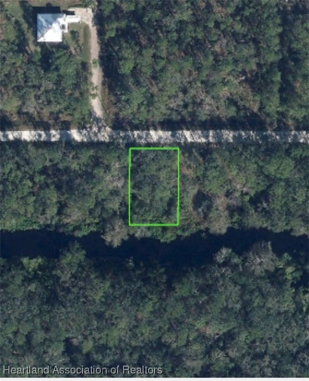609 Canal Way Sebring, FL 33875 - Photo 2 of 2 a view of a yard