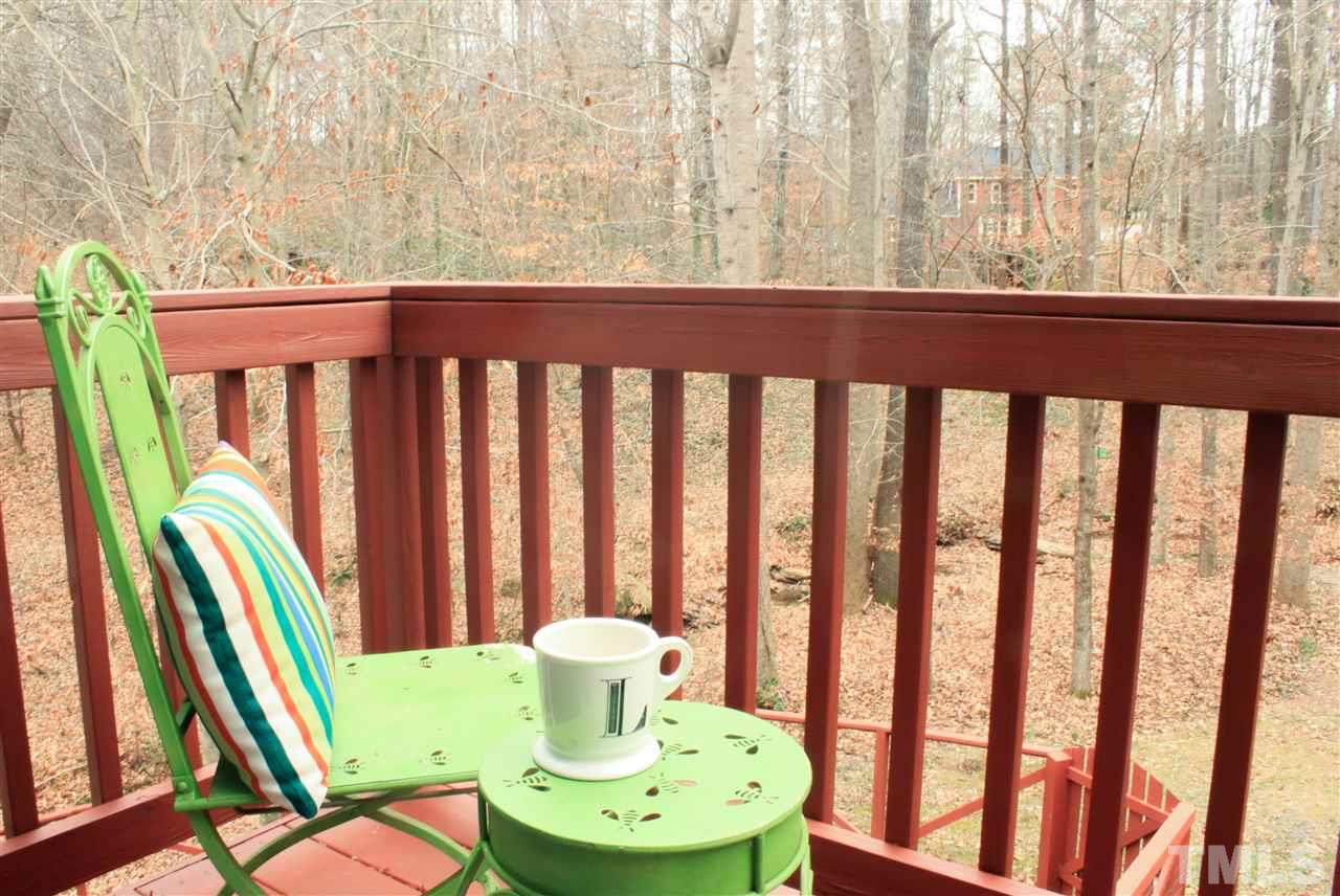 6401 Rushingbrook Drive Raleigh, NC 27612 - Photo 7 of 19 a view of a balcony with wooden floor