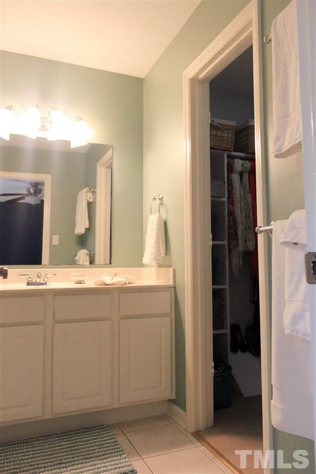6401 Rushingbrook Drive Raleigh, NC 27612 - Photo 8 of 19 a bathroom with a sink and a mirror