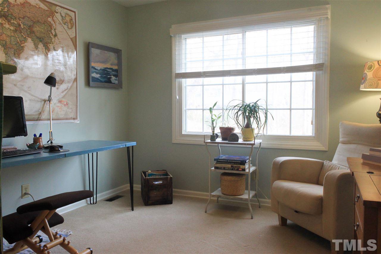 6401 Rushingbrook Drive Raleigh, NC 27612 - Photo 9 of 19 a room with furniture and a window