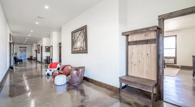 a lobby with furniture and wooden floor