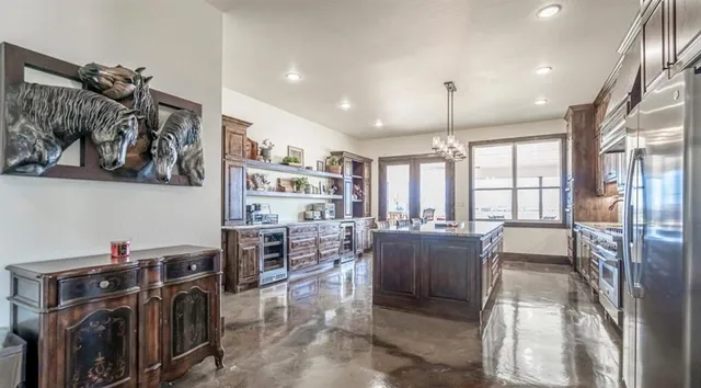 a living room with lots of furniture and a chandelier
