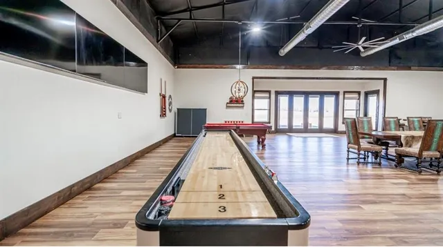 a view of dining room with wooden floor and stairs