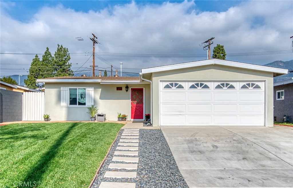 1127 Maynard Drive Duarte, CA 91010 - Photo 2 of 20 a front view of a house with a yard and garage