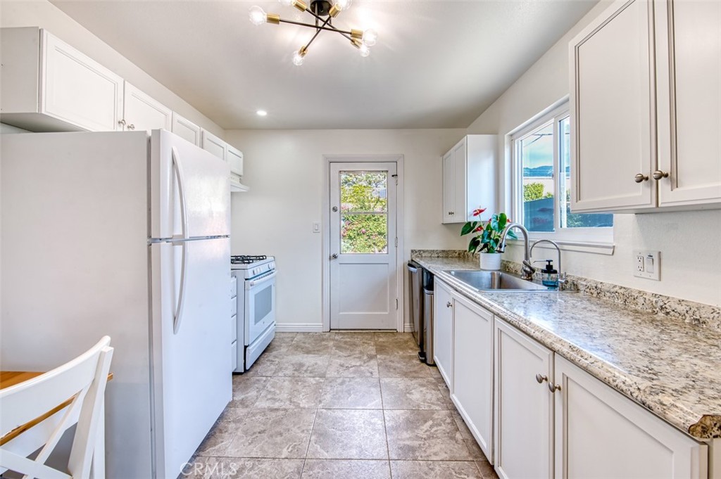 1127 Maynard Drive Duarte, CA 91010 - Photo 8 of 20 a large kitchen with a sink and refrigerator