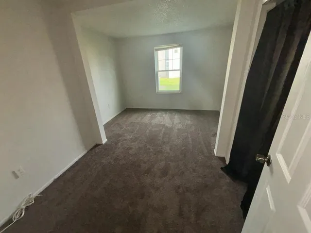 a kitchen with a refrigerator and a sink