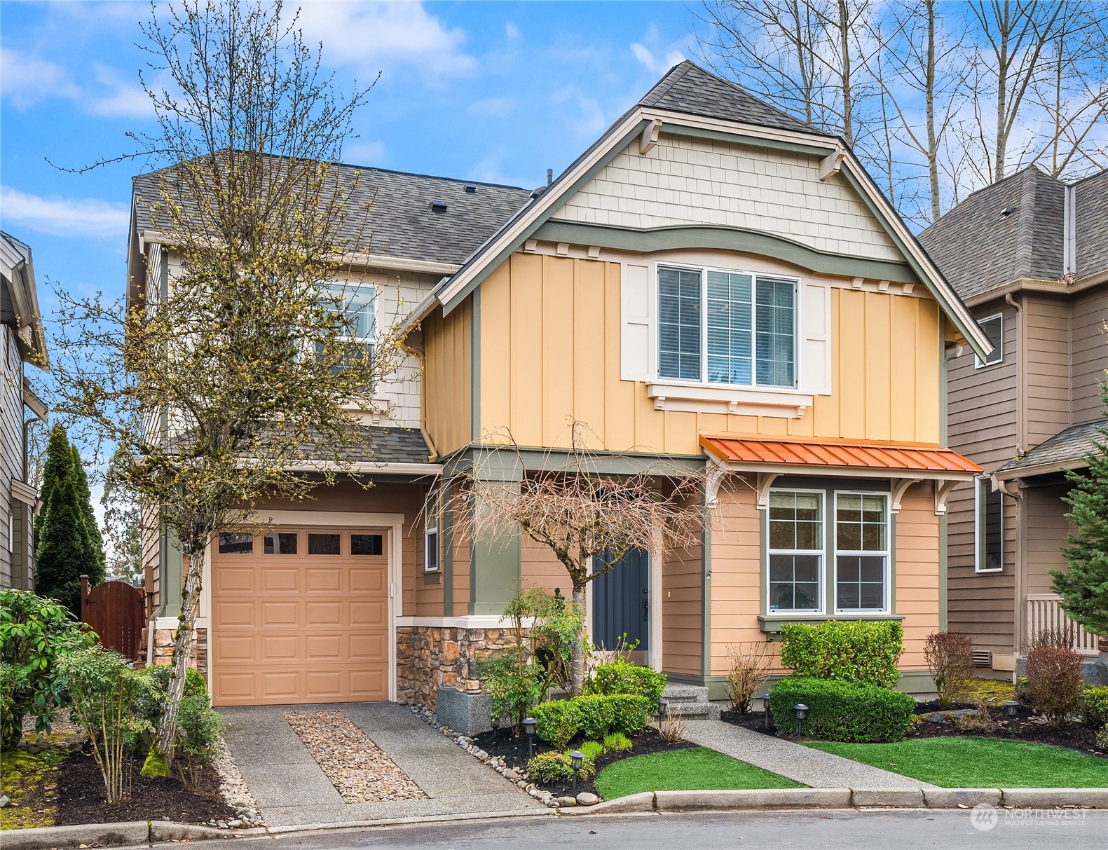 818 235th Place Southeast Bothell, WA 98021 - Photo 1 of 31 a front view of a house with garden