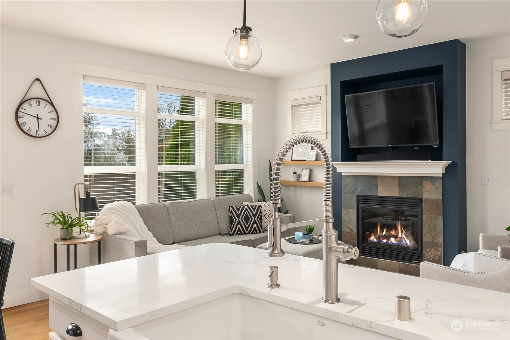 818 235th Place Southeast Bothell, WA 98021 - Photo 11 of 31 a living room with furniture a flat screen tv and a fireplace