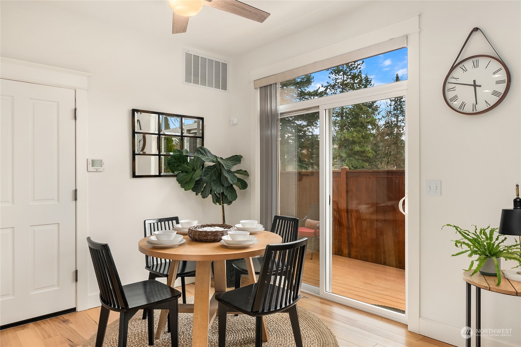 818 235th Place Southeast Bothell, WA 98021 - Photo 15 of 31 a view of a dining room with furniture window and wooden floor