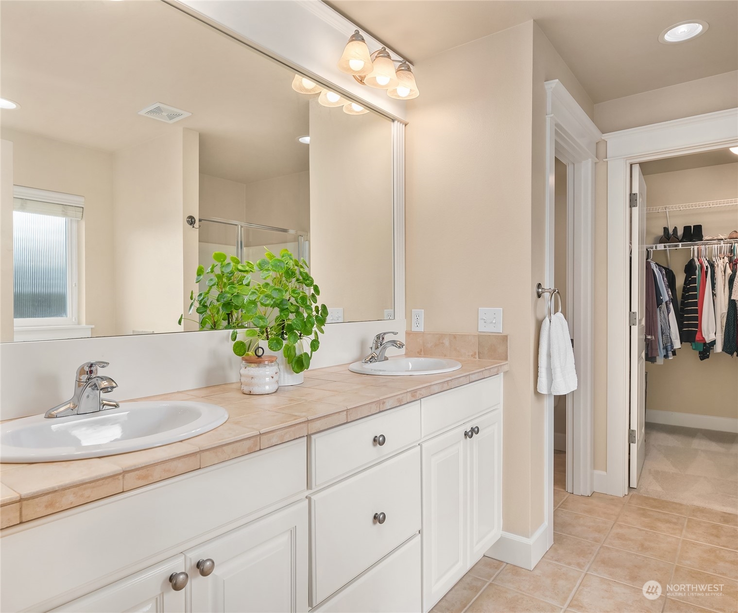 818 235th Place Southeast Bothell, WA 98021 - Photo 20 of 31 a bathroom with a granite countertop sink and a mirror