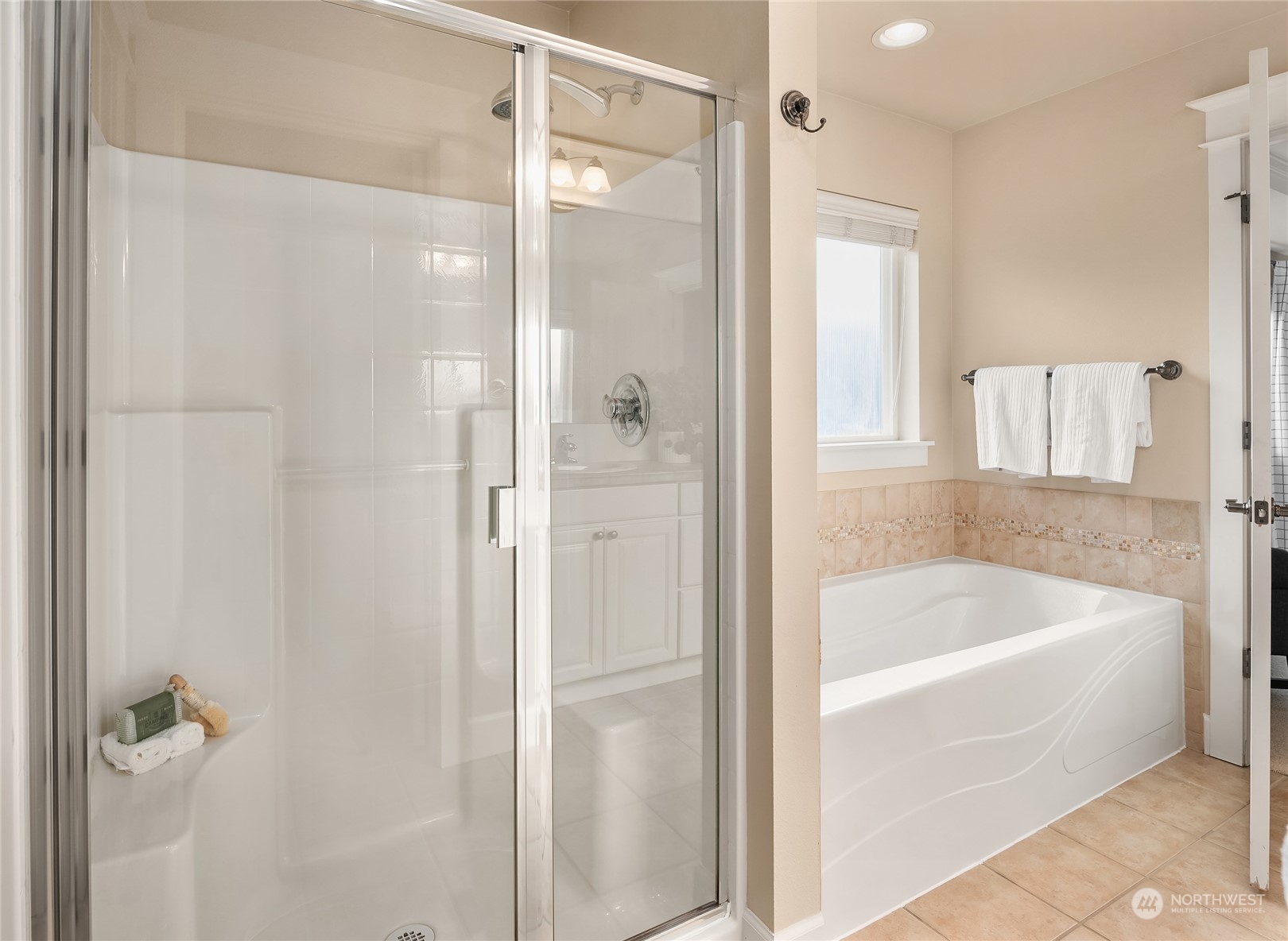 818 235th Place Southeast Bothell, WA 98021 - Photo 21 of 31 a white bath tub sitting next to a shower